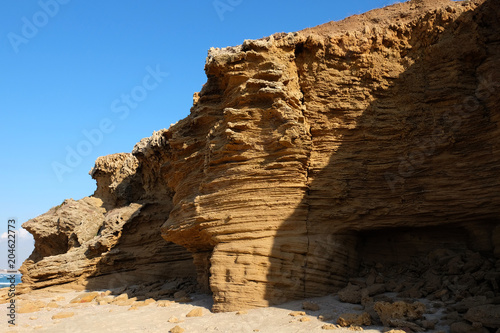 Fotografia  Scenic huge rocks on Palmachim beach, Mediterranean seaside.