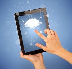 Female fingers touching tablet with cloud concept