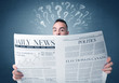 © ra2 studio - Young confused businessman reading daily newspaper with question marks above his head