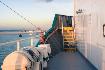 Wall Mural - Ship arrival in port. view from vessel deck. Calm sea