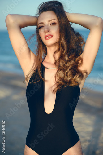 Portrait Of Beautiful Glamour Model With Long Wavy Hair Wearing