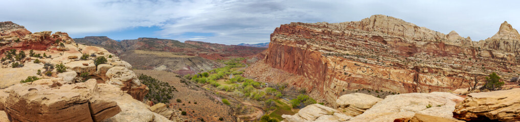 View of Fruita, Utah from the Cohab Canyon Trail. Fruita was an early Mormon settlement in the Capitol Reef area of south-central Utah. Red rock and sandstone cliffs dominate the environment.