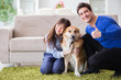 © Elnur - Happy family with golden retriever dog