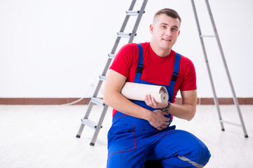 Wall Mural - Contractor worker preparing for wallpaper decoration