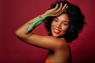 beautiful woman holding chameleon