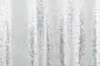 Silver sequins pattern texture fashion background. Horizontal close-up shot.