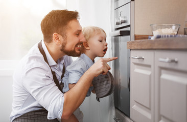 Wall Mural - father with   child   son prepares meal, bakes cookies.