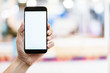 © whyframeshot - business communication ideas concept with hand hold white blank screen smartphone with blur bokeh mall background