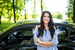 © F8  \ Suport Ukraine - Young beauty woman standing near new car, leaning on auto