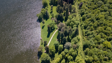 Poster - Drone view of a park next to a lake