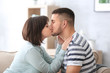 © Africa Studio - Happy young couple kissing at home