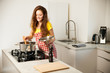 © Samo Trebizan - Beautiful young woman cook a meal in the kitchen