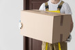 Delivery man with big box close-up