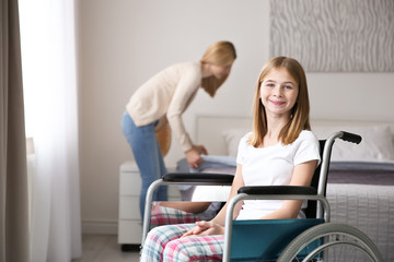 Wall Mural - Teenage girl in wheelchair indoors