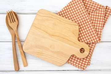 Sticker -  chopping board and tablecloth with wooden fork and spoon on white table , recipes food  for a healthy habits shot note background concept