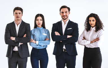 Wall Mural - The four business people standing on the white background