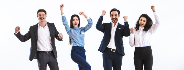 The four business people gesturing on the white background