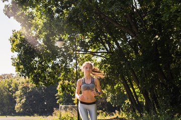 healthy lifestyle young fitness woman running outdoors