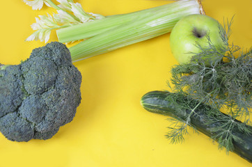 green flat lay organic concept with dill, avocado, cucumber, cabbage, bow, celery, salad, and microgreen sprout isolated with shadow on white background and empty space for text.