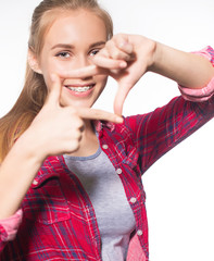 Portrait of teen girl showing dental braces.