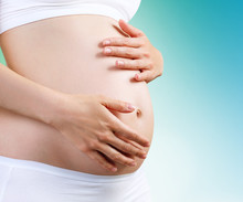 Young Pregnant Woman Caress Belly.
