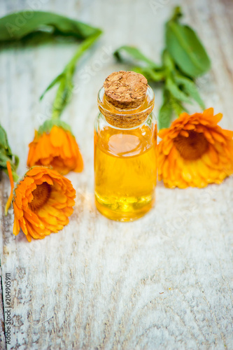 Fotografie, Obraz The calendula extract. Medicinal plants. Selective focus.