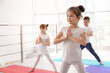 © New Africa - Little children practicing yoga in gym