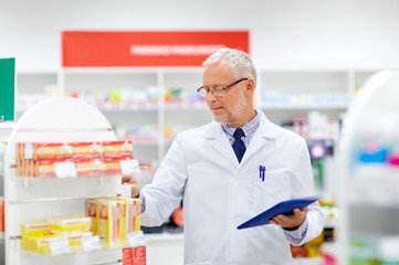 Sticker - medicine, healthcare and technology concept - senior apothecary with tablet pc computer at pharmacy