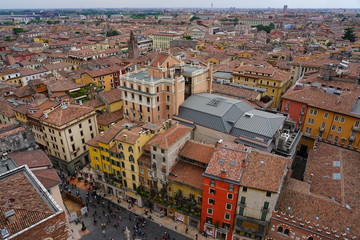 View of buildings and roofs in the old city of Verona, Italy, seen from the top of the Torre dei Lamberti tower