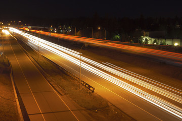 Vehicle light trails on the highway at night.