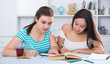 © JackF - Teens girls doing homework and discussing
