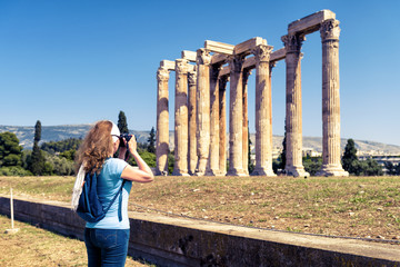 Wall Mural - Woman photographs the Temple of Olympian Zeus, Athens