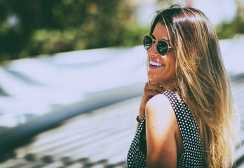 Young beautiful woman wearing sunglasses outdoor. Vintage nostalgia photo