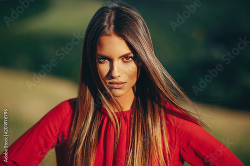 Portrait of a beautiful young woman in nature Poster Mural XXL