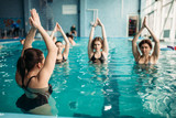 Female group on aqua aerobics in swimming pool