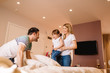 © Nebojsa - Young happy family of three having fun together at home