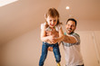© Nebojsa - Young father is holding his daughter in his hands while enjoying their time together