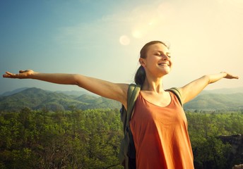 Wall Mural - Woman enjoying th efresh air in nature