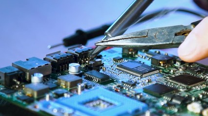 computer hardware engineering. technology science concept. developer soldering motherboard
