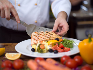 Wall Mural - cook chef decorating garnishing prepared meal