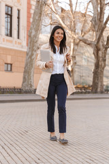 Sticker - Delighted young woman dressed in autumn coat