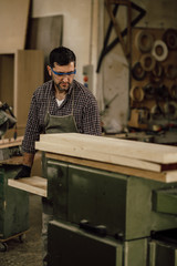 Wall Mural - Skilled Carpenter craftsman at work in his workshop