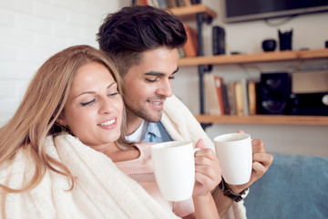 Sticker - Young couple relaxing on a sofa