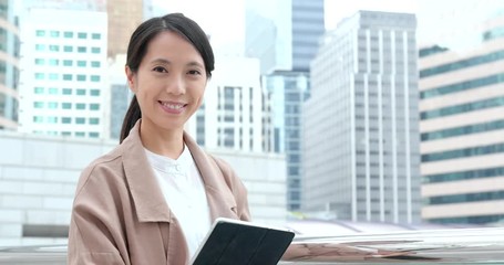 Poster - Business woman holding tablet computer at outdoor