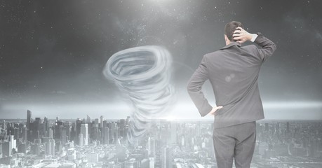 Poster - Tornado twister painted and dark city sky with businessman