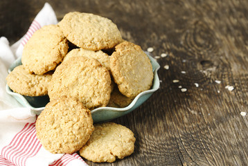 Wall Mural - Homemade oatmeal cookies on wooden table.