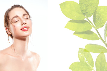 Wall Mural - Beautiful woman portrait with fresh wet skin and green plant.