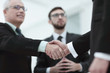 © ASDF - closeup handshake proven business partners