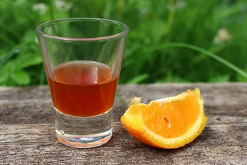 Poster - Tint of orange in a glass