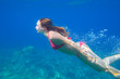 © yanlev - woman swims under water